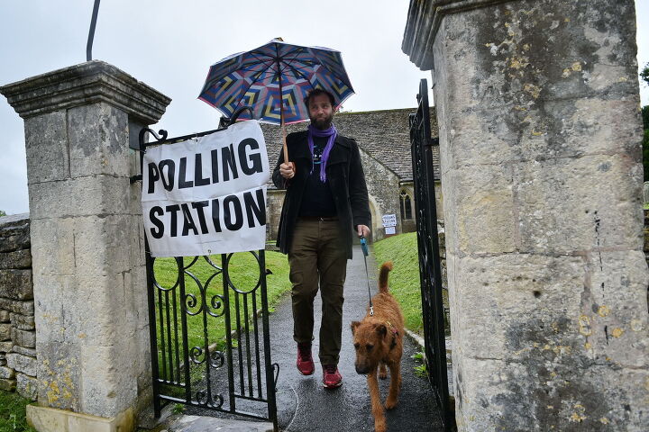 pets take center stage when its time to vote, Photo Credit 1000 Words Shutterstock com